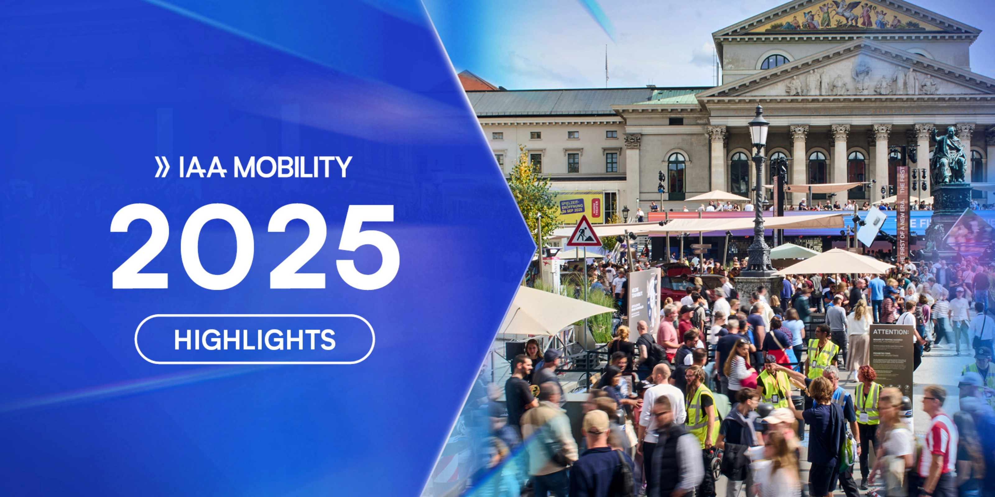 Crowds visit the IAA Mobility 2025 outdoor exhibition in front of a historic building in Munich.